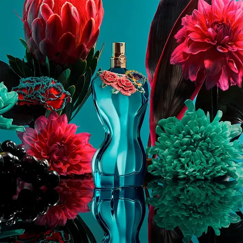 JPG La Belle Paradise Garden bottle surrounded by tropical flowers