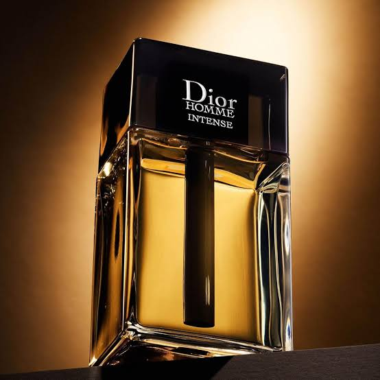 Dior Homme Intense bottle golden background