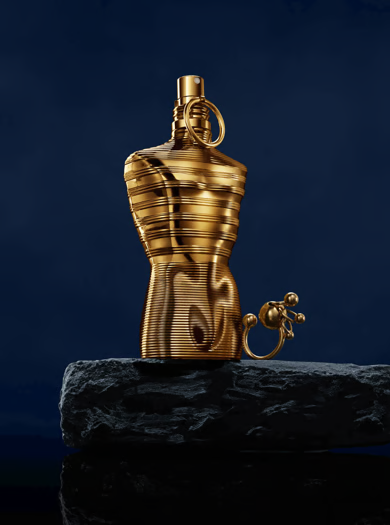 JPG Le Male Elixir Absolu gold bottle on dark rock