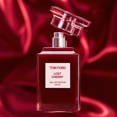 Tom Ford Lost Cherry bottle on red silk fabric