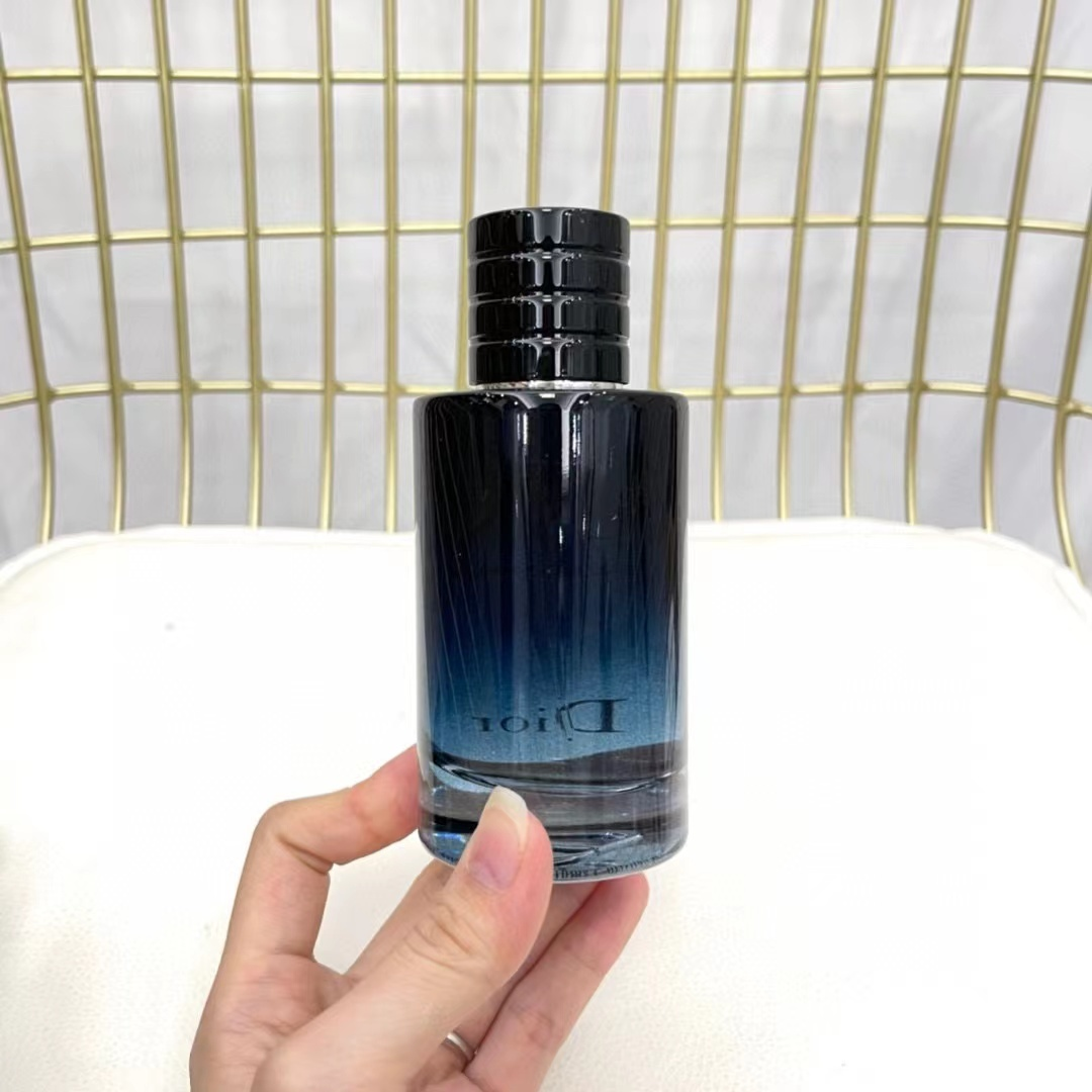 Dior Sauvage EDP 100ml bottle held in hand back view