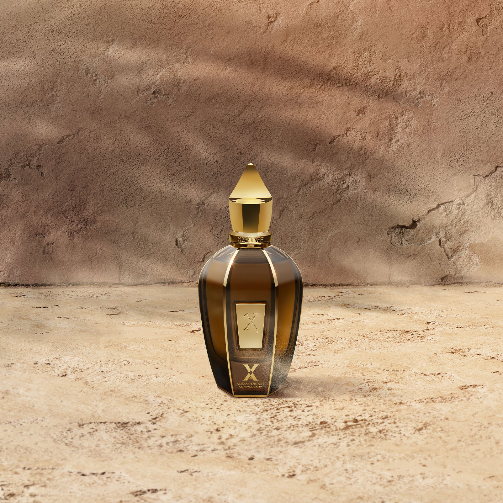 Xerjoff Alexandria II Anniversary bottle on sandy surface